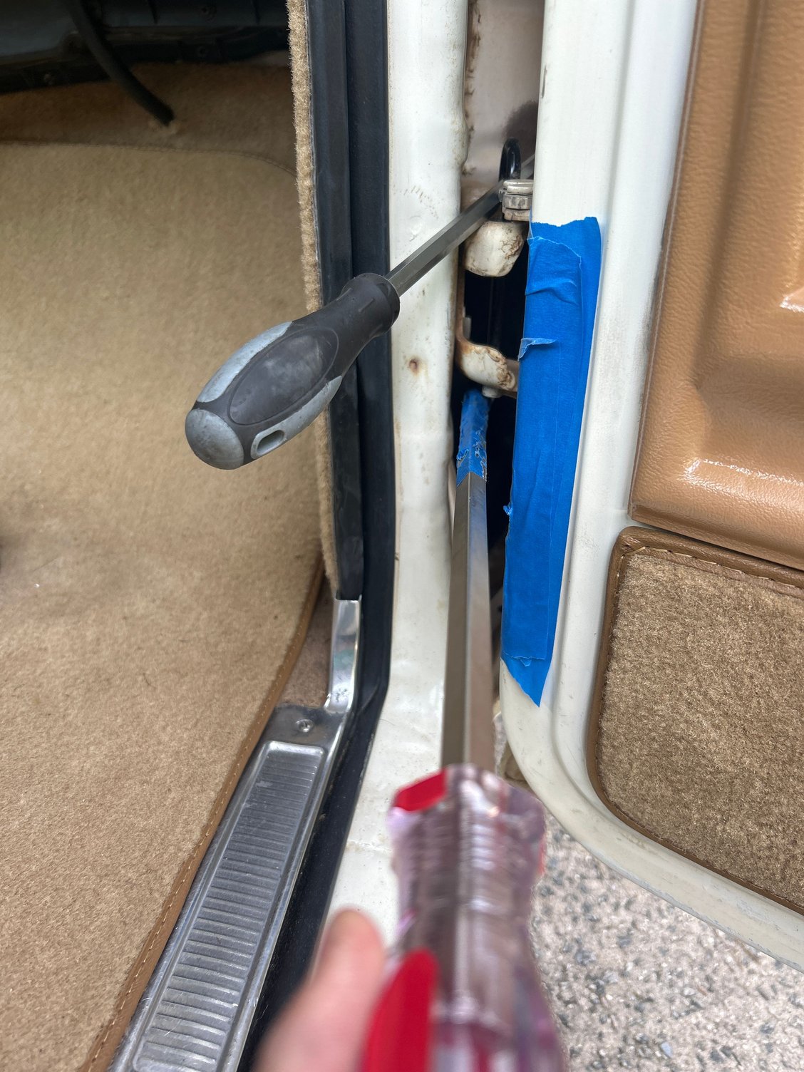 Get two of your longest screwdrivers