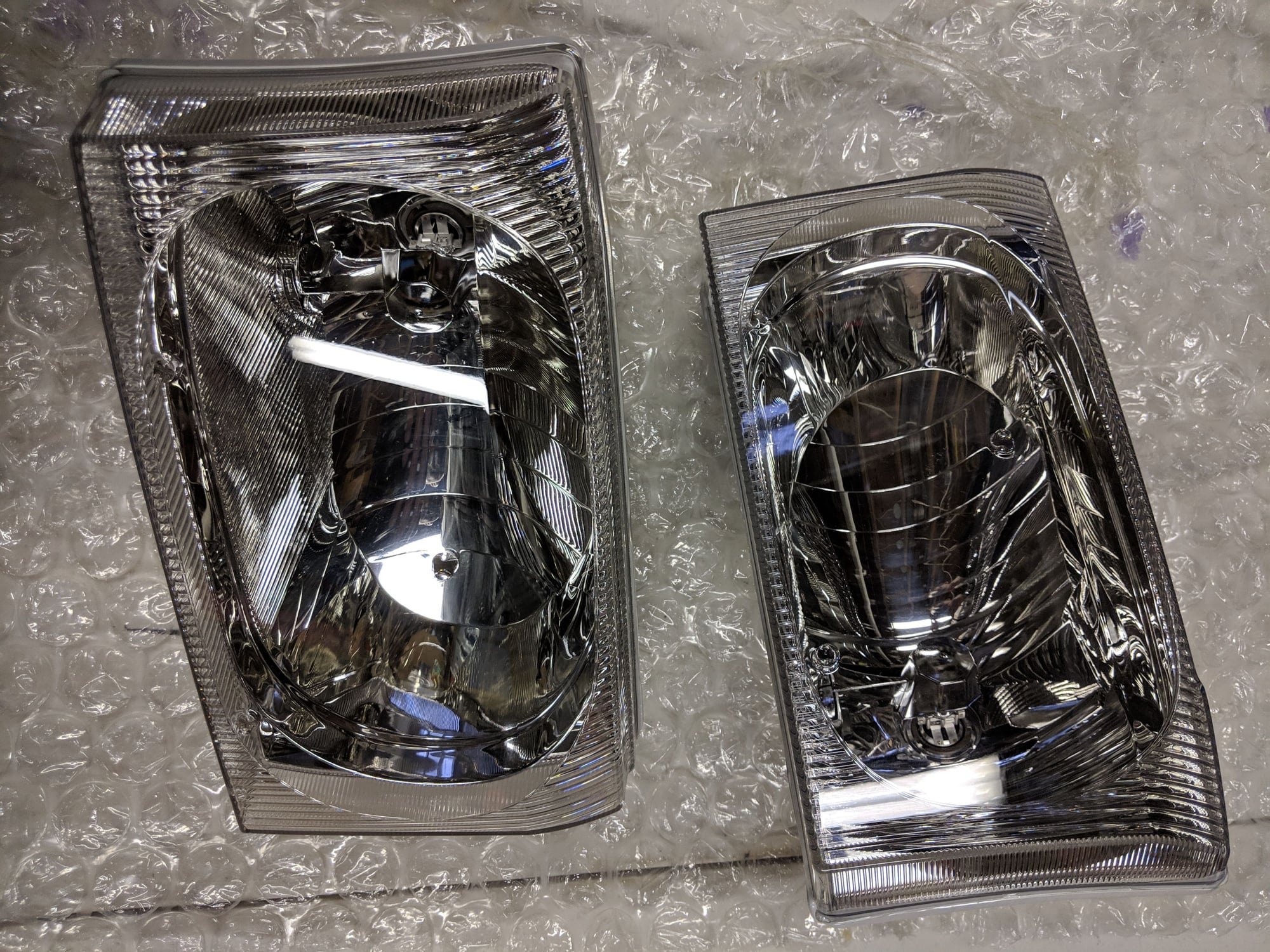 Lights - 1999-2004 F250 Excursion Clear Lens Headlamps - New - 1999 to 2004 Ford Excursion - 2000 to 2004 Ford Expedition - Milford, MI 48380, United States