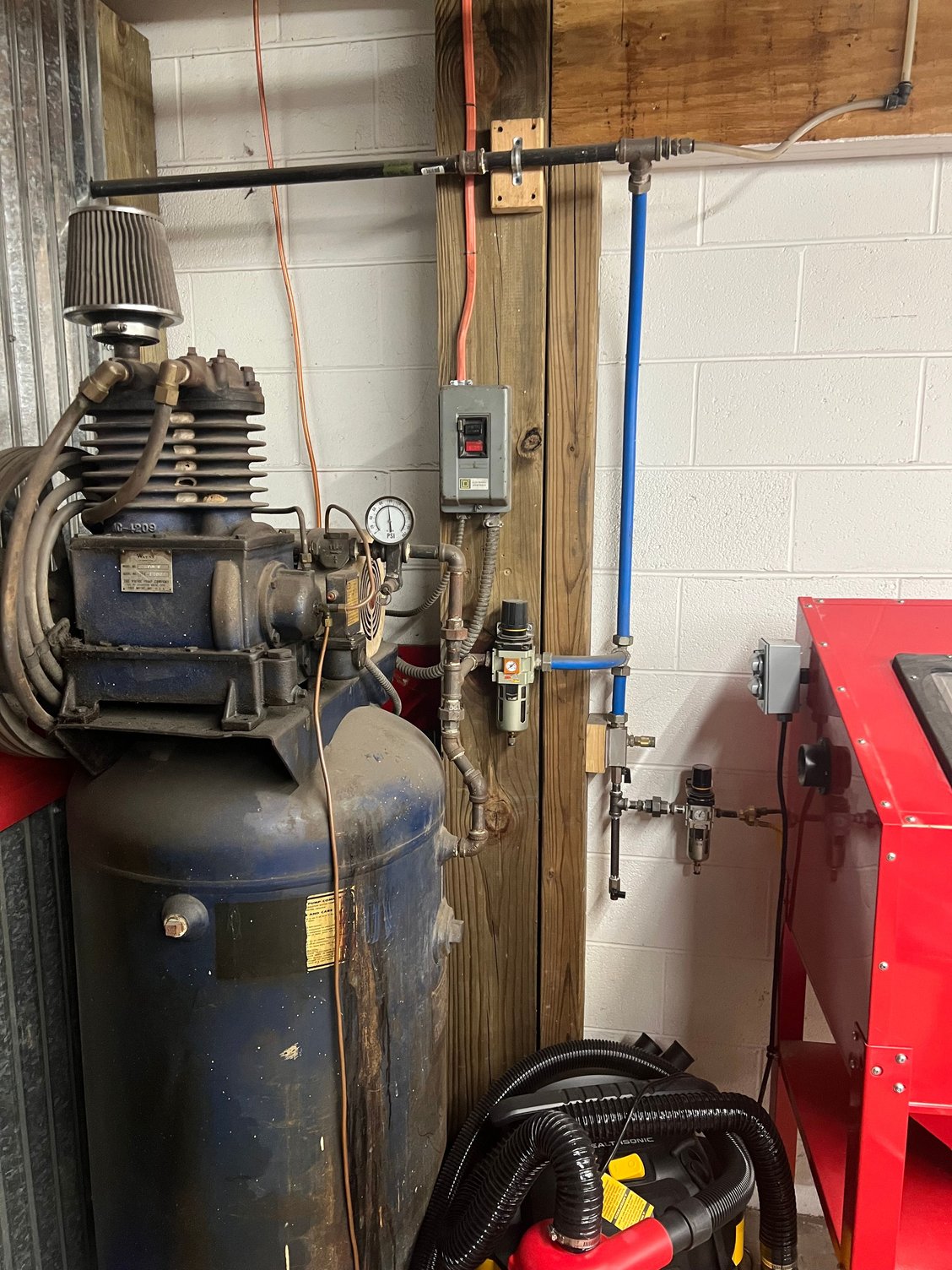 The blaster and air nozzle are fed from the second smaller separator. I purge the drip leg and both separators, but I�m guessing I need a grid to cool and dry the air. I think the compressor is 60 or 80 gallons. I�ve also an extra 100 gallon tank tied in with the line going over the top of the compressor for additional volume.