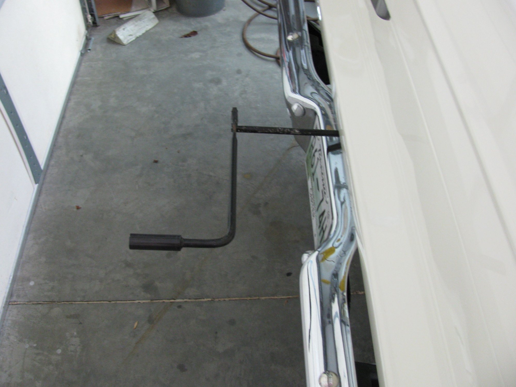 Putting a new model spare tire hoist under 66 F100 Ford Truck