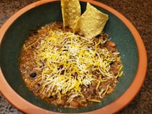 Homemade chili and tortilla chips used for dipping. 