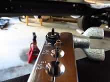 Starting with a straight end with a square cut, put the fitting on first, and then clamp the tube into the clamp bar. Use the shoulder of the die as a gage to have the correct stick-out, as shown.
BTW, be sure to deburr the tube first.