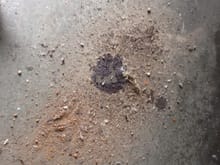 The dirt that fell from the fender
