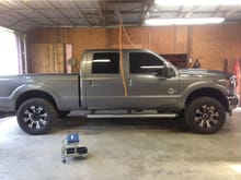 Truck with Rough Country Level Kit, 20x9 Gear Alloy Back Country, Toyo A/T II Open Country