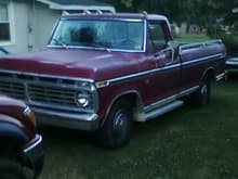 This is my $500.00 1975 f100. Chrome side steps, rails, running lights, chrome cargo light and all original tires and caps. 

NEEDS: Replace windshield and some window pcs and cleanign up, other than that, I like her. When she gets paint, probably carolina blue /white combo. :)