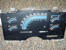 Front side of the 89 Astro van instrument panel. I got to thinking this might work because the speedometer sweep angle would be similar to my 54 speedometer panel.