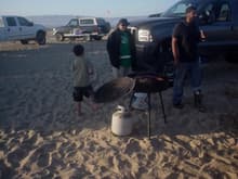 Aidric getting ready to close the lid with his foot, and JR and amigo chowing down. Of course the best Bronco on the beach is in the background :)