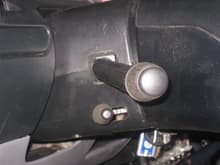 Tilt wheel lever installed and lower portion of steering column cover from automatic truck.