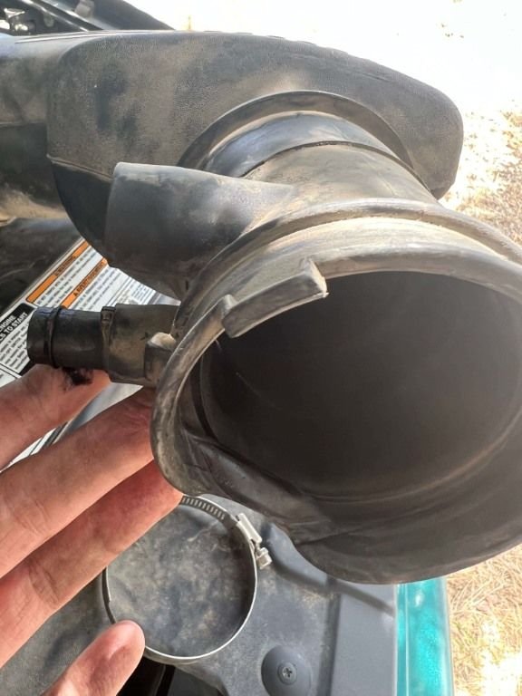 Air intake hose deformed at throttle body connection and vacuum leaks