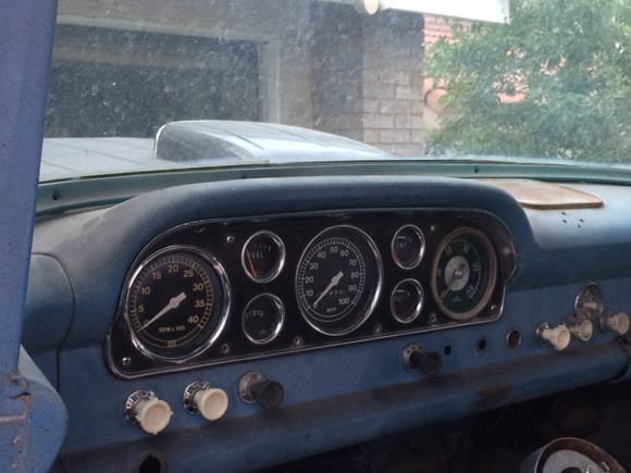 Getting the dash together. Chrome gauge cluster. A few new knobs and switches.
