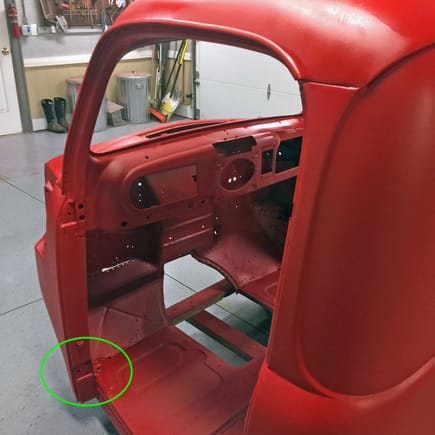 Lower hinge pocket.  Sand hinge and pocket matching surface to lower door handle and tighten lower-front gap.  Or add thin shims (gasket material OK) in order to widen gap and raise rear of door.
