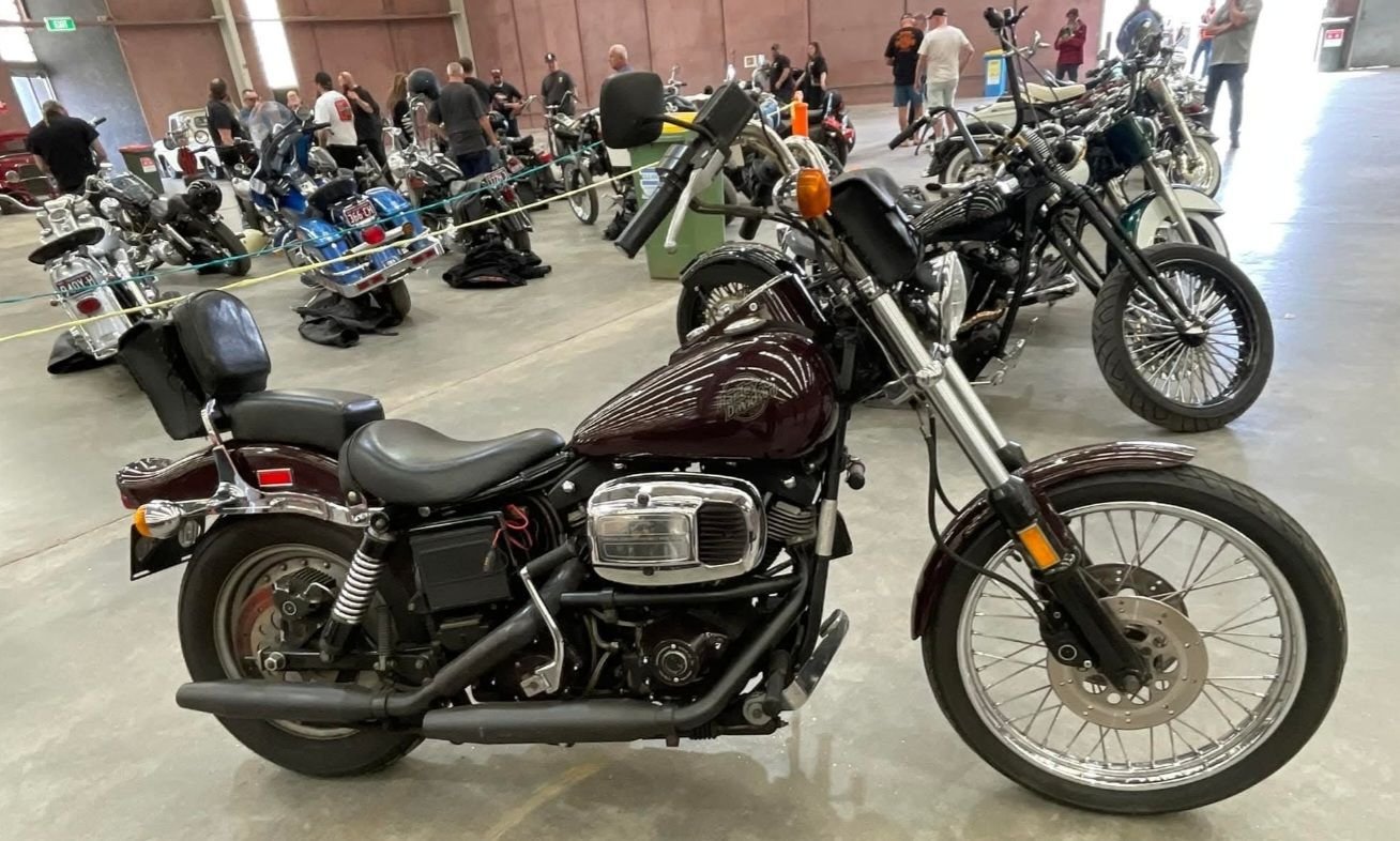 A very original FXDG Twin Belt Wide Glide,  looks like it might have had some work done the heads are bare aluminum & it is missing the braided steel oil lines , but a really nice example !