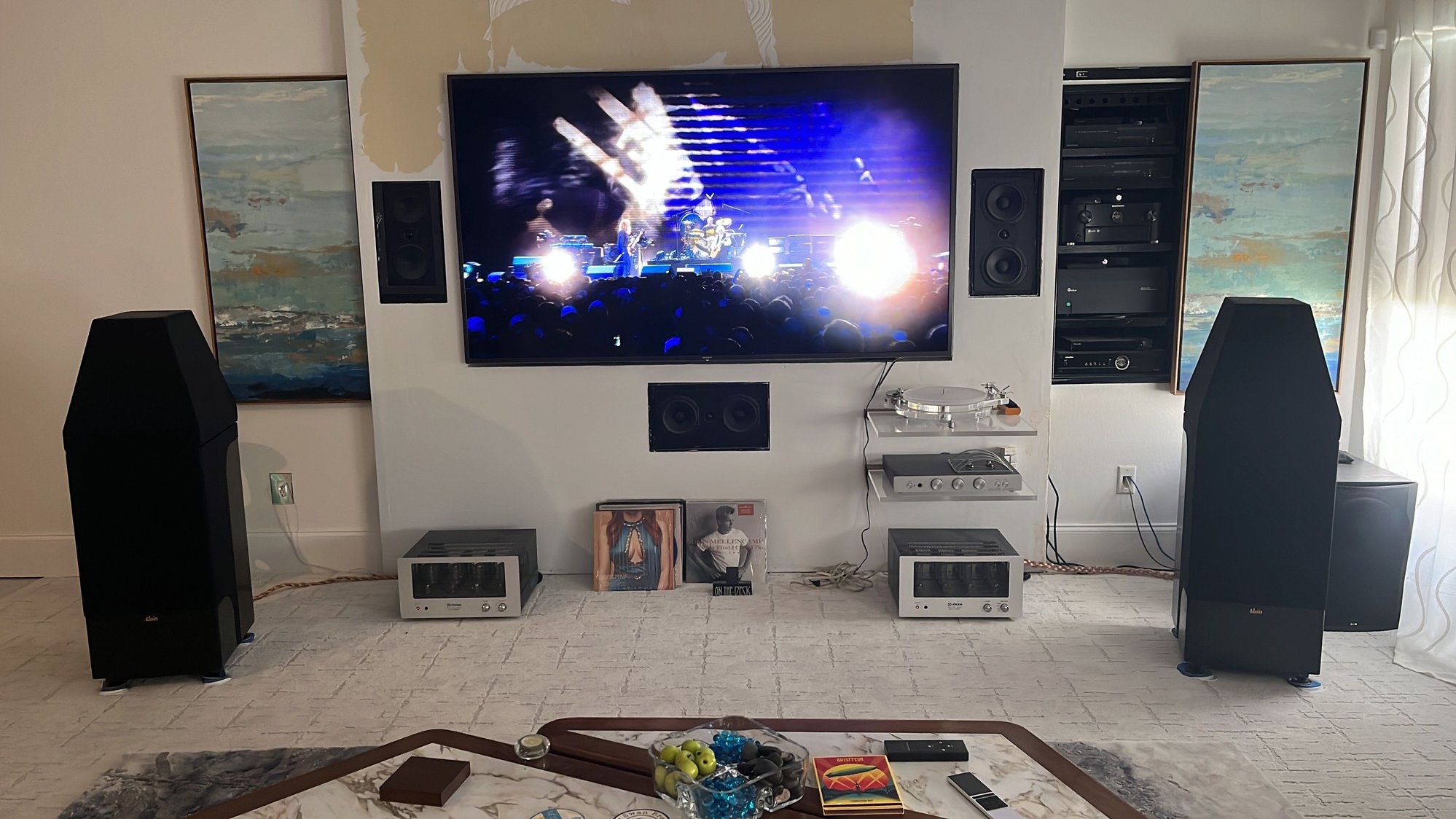 I spin records about an hour an evening. Sometimes like in this picture I turn the TV on without sound with band live performances.. or Vintage motorcycle racing.