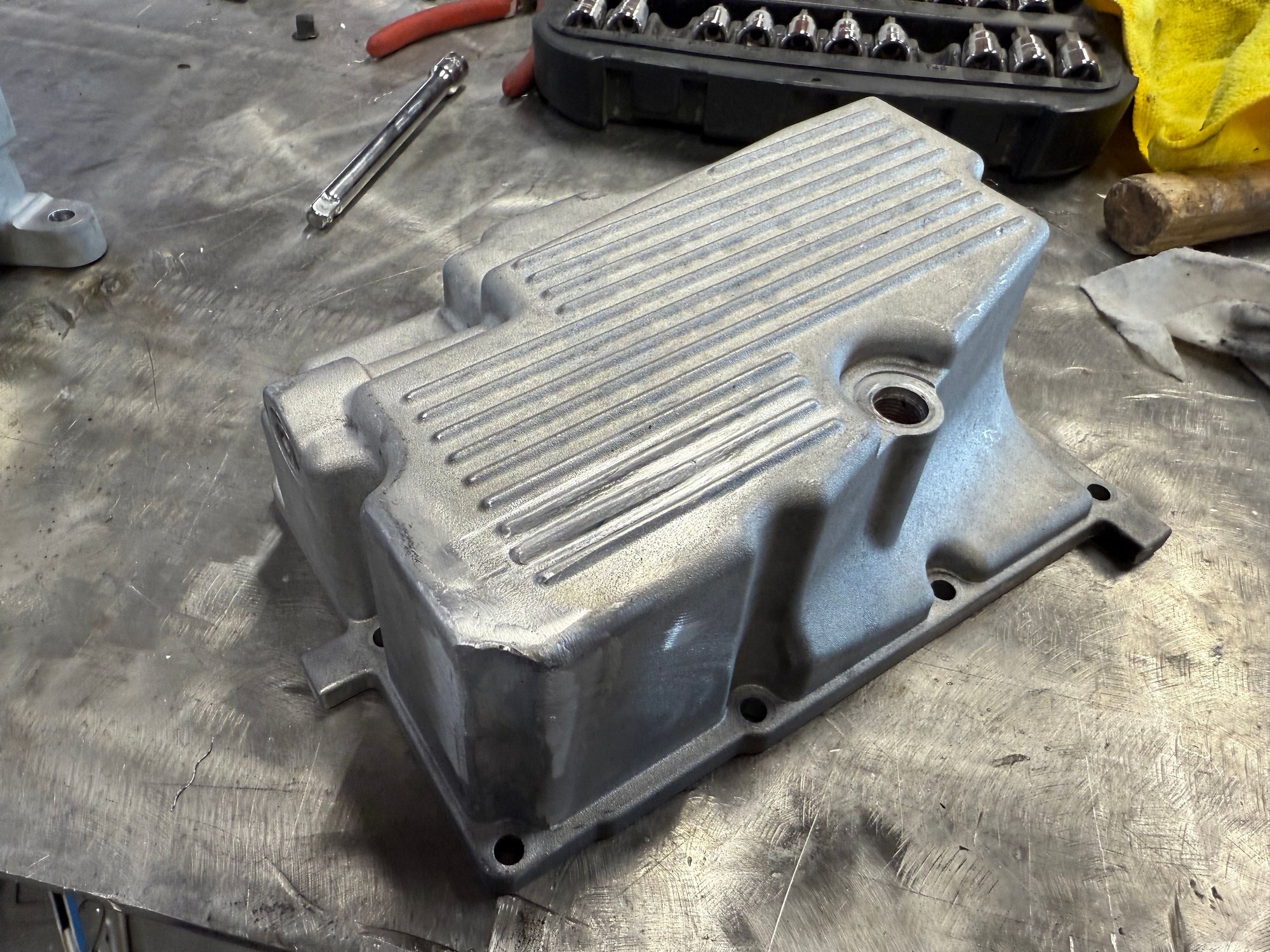 There was a crack through the 2nd and 3rd ribs.  Ground them down, repaired the crack and rebuild the ribs as best I could.  The front left corner had a hole also.