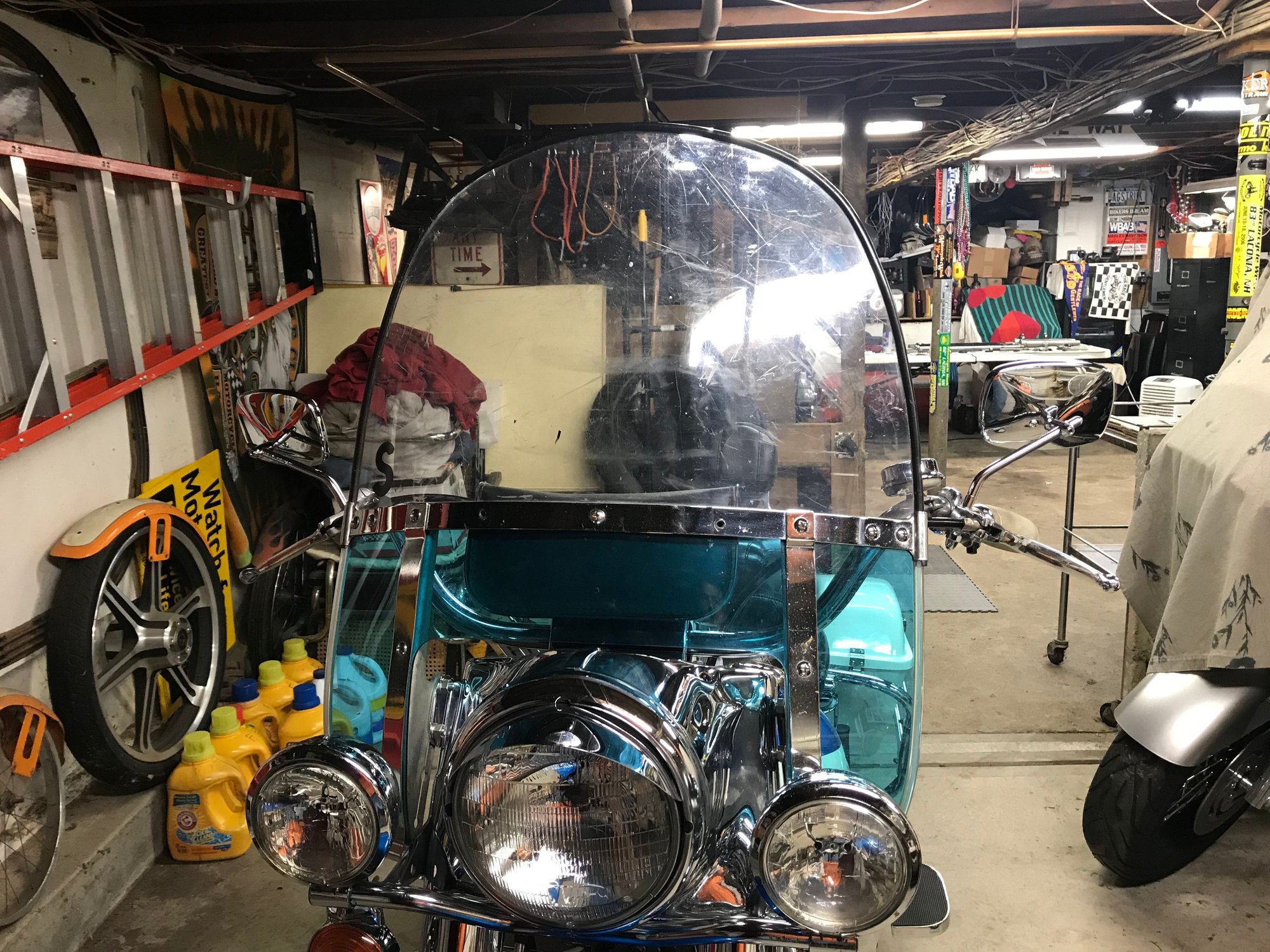 Ramp is behind me, three bikes parked on the right. Vintage parking at the other end as is the main work space.