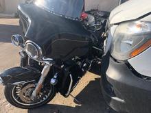 The van is just next to the bike at the towing company.  Hit a Toyota Corolla