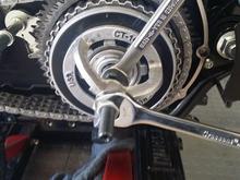 crank till you can get the spring seat and new retaining ring on