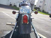 Rear Wide Tomsbstone tail light with standard NT strut-mounted turn signals. Also used Laydown license plate bracket (but had to mount  approximately 1/2" higher due to the Tombstone kit). I used small black plastic hole plugs to fill the factory license plate mounting holes.