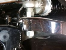 Here's the stock upper mount with shock installed and one of the provided spacers for the acorn nut to tighten down onto. Without the spacer, there aren't enough threads, as the Ohlins shock eye is about half the thickness of the factory shock eye.