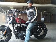 As you can see in the pic, i dont have to lean forward hardly at all. I have a bad back and the drag bars were iut of the question. These bars were on my bike on the showroom floir so in not sure exactly what brand they are but they are comfy and look great in my opinion.