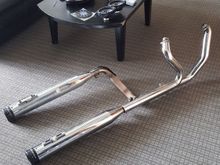 The stock header has the cat removed. These were on a 2011 ultra classic.  Header is from 2011,  the slip ons are a year old.  Im puting a bigger motor in my bike and going with a 2-1 pipe. 

$300 or best or trade. 

Also have other parts. All open for offers or trade. Id let all of it go for a set of stock 13 inch 12 way adjustable shocks off a newer ultra.