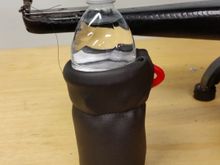 Covered the plastic collar with some vinyl and sewed it together 1/3 of the way down so it can't come off while running down the road.