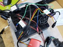 The back of the Biketronics housing after installing the SiriusXM tuner. The big orange thing is the BT-1014x hand-control interface. Both USB cables (USB1 on the right, USB2 on the left) are 6' long!