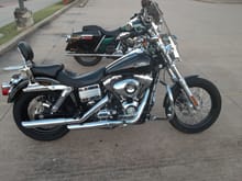 I have the larger Harley  quick release windshield . Blocks most of the wind and the buffeting isnt bad either.