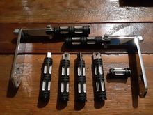 Set of Harley edge cut footpegs, passenger pegs, highway bars with pegs and shifter peg . In good condition with a couple of minor scrapes . Set is ver expensive new asking $90.