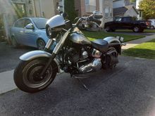 Ive always wanted to put a 1/4 fairing on my fatboy. Could never find a style i really liked and couldnt find the style i wanted to fit a softail.

Well i found this one and made it work. $40 spent total so far, 20 for this miscellaneous scratched fairing 20 for paint.