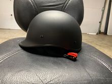 Side view. Notice the ratchet strap. No D-ring.