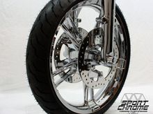 Sport Chrome Enforcer front wheel shown with mirror polished discs, chrome disc hardware, chrome fork legs, ABS wheel spacers, super-small axle covers and a mounted and balanced Dunlop American Elite front tire.