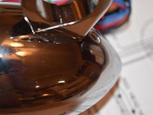 Slight scratch in the chrome next to the mount. On the bottom of the unit. Hard to see.