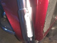 The clear plastic part houses the LED assembly snaps over the tubing and is sealed to the tubing all the way around with a squished layer of silicone.  You can see if it seals.  Then the metal cover snaps in place and is screwed down.  The clear plastic is visible all the way around the metal cover (it's the same size) and light gets out around the edges, which is cool.  The clear part sticks out past the metal by about 1/8" or so, adding to side visibility.