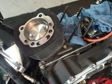 Had the jugs honed at a local machine shop. $42, wiped with clean engine oil, and slid the piston in and mounted it by sliding it down to get to the connecting rod and push the pin through. install remaining c-clip.  The other one I used a ring compressor.  I didn't have it available when i did the first one. Boy that makes it a lot easier.  