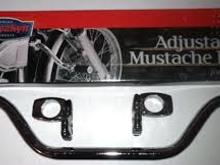 This is a mustache bar. They bolt across the frame a little bit under the bottom of the frames neck.