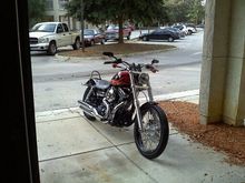 My glide with stock risers and bars