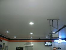 I put 16 can lights in there and they are doing a great job with flourescent bulbs in them.