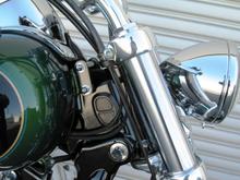 *2006 Deuce Headlight
*2006 Sportster Custom mount
*1.60" Tank Lift.
*Routed front frame and console wire harnesses to left side of the bike

Info here: http://www.hdforums.com/forum/dyna-glide-models/211467-tank-lift-headlight-front-signal-mounts.html