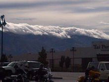 Beautiful view of the clouds hanging on the moutains.