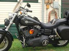 DSC01450 Medium Leatherman cruiser 2 sissybar bag holds my medium leather jacket with the insulated liner in it,and vest but no room left after that but gives you an idea how big it is. Took off most of the mounting system, but the center quick release strap works great with the hole in the Corbin backrest and the other two quick release straps secure it from moving around and i like the easy removal.