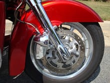 Brembo caliper; stainless lines; Motolights; RWD front fender; Road Glide silver wagon wheel; HD chrome front end and clamshell caps.
