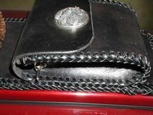 In this closeup of the pouch a spring loaded momentary switch can be seen. It activates the garage door opener! As I'm rolling up to the house I press that switch for a moment and door is open!