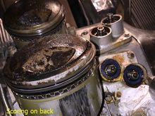 Some rear scoring on backside of rear piston