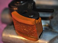 Old-style spring tensioner on a link chain never stops wearing.