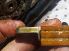 HDFORUM USER.  Roller chain at 90K. You can see the roller touching.  Wear practical stops then in this USER's opinion. 