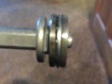 see all the way to left, the shaft and what looks like a washer, well thats part of shaft I had one guy said it all comes off, and another said no?
