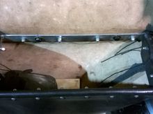 Inside the bag, I made a square frame from 1" x 3/16" stainless steel. Then I folded the leather over and put #10-24 ss button heads on the underside and secured them with ss acorn nuts.