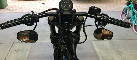 Controls mounted on left of bars 