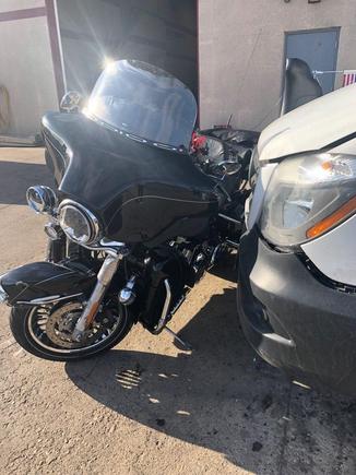 The van is just next to the bike at the towing company.  Hit a Toyota Corolla